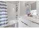Bathroom with a shower/tub combo and striped shower curtain at 687 Banton Nw Dr, Atlanta, GA 30318