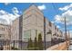 Modern townhome with gray and white exterior, fenced yard, and city views at 687 Banton Nw Dr, Atlanta, GA 30318