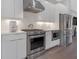 Modern kitchen with stainless steel appliances and white cabinets at 687 Banton Nw Dr, Atlanta, GA 30318