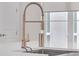 Modern kitchen sink and faucet with a brushed gold finish at 687 Banton Nw Dr, Atlanta, GA 30318