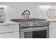 Stainless steel range and white herringbone backsplash at 687 Banton Nw Dr, Atlanta, GA 30318