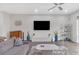 Spacious living room with hardwood floors and a large TV at 687 Banton Nw Dr, Atlanta, GA 30318