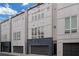 Exterior view of three modern townhouses with attached garages at 687 Banton Nw Dr, Atlanta, GA 30318