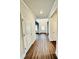 Hardwood floor hallway with white doors and crown molding at 161 Silvercrest Dr, Acworth, GA 30101