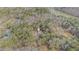 Aerial view of house and surrounding wooded lot near lake at 1791 Lake George Dr, Lithia Springs, GA 30122