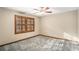 Well-lit bedroom with ceiling fan and window shutters at 1791 Lake George Dr, Lithia Springs, GA 30122