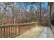 Wooden deck overlooks private backyard with mature trees at 1791 Lake George Dr, Lithia Springs, GA 30122