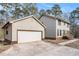 Attached two-car garage with driveway at 1791 Lake George Dr, Lithia Springs, GA 30122