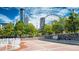 Vibrant city park with a Ferris wheel and skyscrapers in the background at 2098 Moss Hill Rd, Stone Mountain, GA 30088