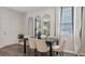 Elegant dining room with six chairs and large windows at 2098 Moss Hill Rd, Stone Mountain, GA 30088