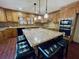 Kitchen with large granite island and wood cabinets at 342 Mccurry Rd, Stockbridge, GA 30281