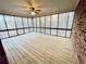 Screened porch with wood decking and brick wall at 342 Mccurry Rd, Stockbridge, GA 30281