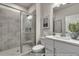 Modern bathroom featuring walk-in shower, sleek vanity, and tiled walls at 3812 Thatcher Sw Dr, Marietta, GA 30008