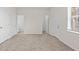 Spacious bedroom with neutral carpet and white doors at 3812 Thatcher Sw Dr, Marietta, GA 30008