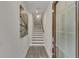 Bright hallway featuring hardwood floors, fresh paint and natural lighting from front door at 3812 Thatcher Sw Dr, Marietta, GA 30008