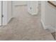 Hallway with neutral carpeting and doors at 3812 Thatcher Sw Dr, Marietta, GA 30008