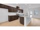 Modern kitchen features stainless steel appliances, granite countertops, and dark wood cabinets at 3812 Thatcher Sw Dr, Marietta, GA 30008