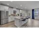 Modern kitchen with stainless steel appliances, quartz counters, and an island with seating at 3812 Thatcher Sw Dr, Marietta, GA 30008