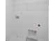 Empty laundry room featuring a water heater access panel and wire shelving at 3812 Thatcher Sw Dr, Marietta, GA 30008