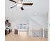 Open-concept living area with modern kitchen, staircase, and abundant natural light at 3812 Thatcher Sw Dr, Marietta, GA 30008