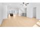 Expansive living area with light wood flooring, recessed lighting, and an open staircase at 3812 Thatcher Sw Dr, Marietta, GA 30008