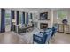 Well-lit living room features cozy seating, fireplace and picture windows with natural light at 3812 Thatcher Sw Dr, Marietta, GA 30008