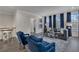 Open floor plan living room features hardwood floors, large windows, and stylish decor at 3812 Thatcher Sw Dr, Marietta, GA 30008