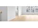 Bright living room with light wood floors and ample natural light from large windows at 3812 Thatcher Sw Dr, Marietta, GA 30008