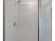 Luxurious tiled shower featuring a sleek shower head and built in shelving at 3812 Thatcher Sw Dr, Marietta, GA 30008