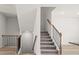 Elegant staircase with metal railing at 3812 Thatcher Sw Dr, Marietta, GA 30008