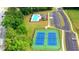 Aerial shot showcases the community pool and tennis courts, surrounded by lush greenery at 5424 Flat Rock Point, Stonecrest, GA 30038