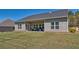 A well-manicured lawn complements this home's exterior, enhancing its curb appeal at 5424 Flat Rock Point, Stonecrest, GA 30038