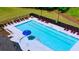 Aerial view of the community pool with lounge chairs surrounding the refreshing water at 5424 Flat Rock Point, Stonecrest, GA 30038