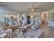 Spacious living area blending seamlessly into a kitchen and featuring modern furnishings at 5424 Flat Rock Point, Stonecrest, GA 30038