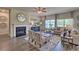 Bright and airy living room with a fireplace, stylish seating, and large windows at 5424 Flat Rock Point, Stonecrest, GA 30038