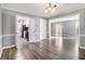 Open concept dining room with views into the living room and kitchen at 113 Rue Fontaine # 113, Lithonia, GA 30038
