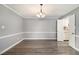 Spacious dining room with hardwood floors and chandelier at 113 Rue Fontaine # 113, Lithonia, GA 30038