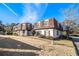 Townhouse building with brown roof and landscaping, sunny day at 113 Rue Fontaine # 113, Lithonia, GA 30038