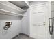 Laundry area with shelving and exterior access at 113 Rue Fontaine # 113, Lithonia, GA 30038