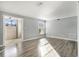Bright living room boasts hardwood floors and neutral paint, perfect for a comfortable living space at 113 Rue Fontaine # 113, Lithonia, GA 30038
