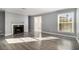 Living room with fireplace, hardwood floors, and gray walls at 113 Rue Fontaine # 113, Lithonia, GA 30038
