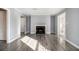 Living room with fireplace, hardwood floors, and gray walls at 113 Rue Fontaine # 113, Lithonia, GA 30038