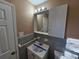 Clean bathroom with vanity, medicine cabinet, and gray tile at 1613 Gilston Ct, Decatur, GA 30032