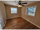 Bedroom with hardwood floors, ceiling fan and two windows at 1613 Gilston Ct, Decatur, GA 30032