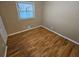 Spacious bedroom with hardwood floors and large window at 1613 Gilston Ct, Decatur, GA 30032