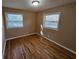 Hardwood floor bedroom with two windows at 1613 Gilston Ct, Decatur, GA 30032