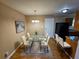 Dining room with hardwood floors, glass table and chairs at 1613 Gilston Ct, Decatur, GA 30032