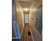 Long hallway with hardwood floors and access to bedrooms at 1613 Gilston Ct, Decatur, GA 30032