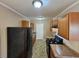 Bright kitchen with wood cabinets, gas range and refrigerator at 1613 Gilston Ct, Decatur, GA 30032