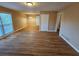 Hardwood floor living room with access to kitchen and other rooms at 1613 Gilston Ct, Decatur, GA 30032
